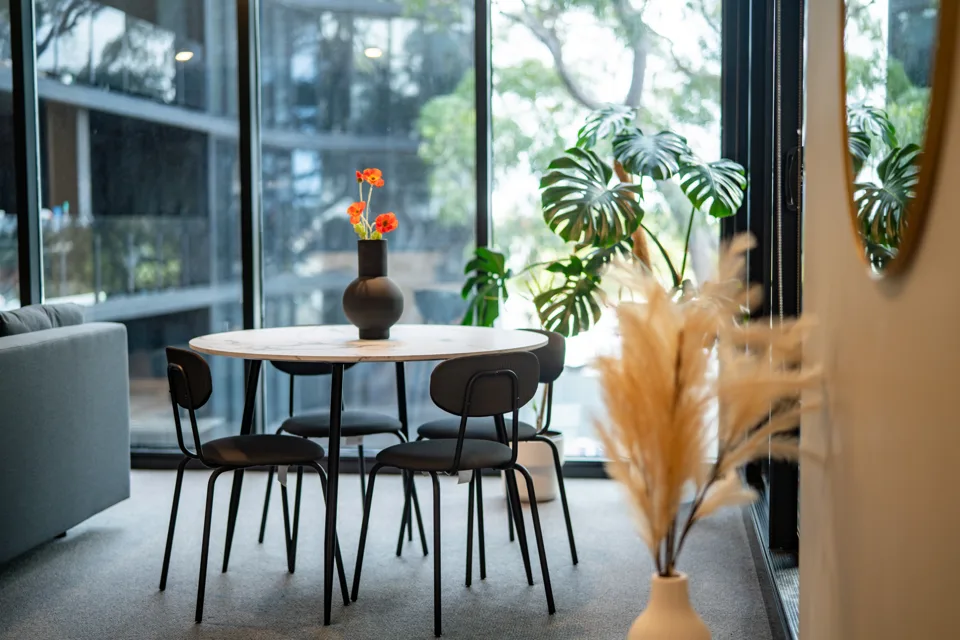 Dining table beside the balcony doors